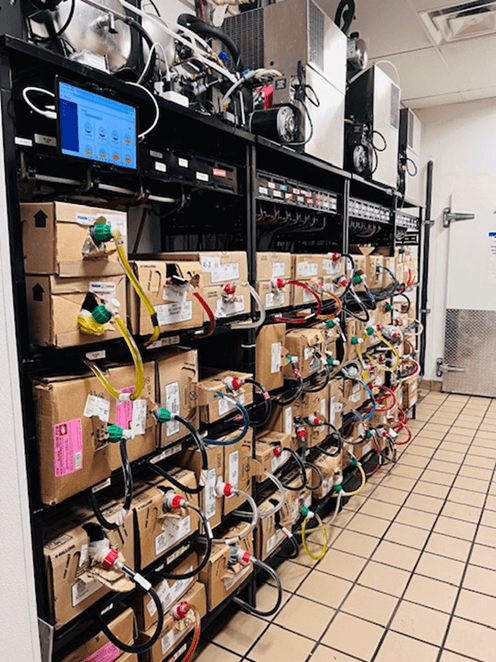 BIB rack with Liquid Insight monitoring tablet in a QSR back-of-house